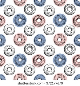  Hand drawn vector illustration - Seamless pattern with tasty donuts. Sketch. Sweet desserts