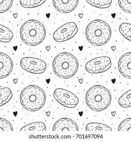 Hand drawn vector illustration - Seamless pattern with tasty donuts.