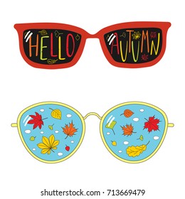 Hand drawn vector illustration of vintage glasses, with text Hello Autumn, falling leaves and clouds inside the lenses. Isolated objects on white background. Design concept for change of seasons.