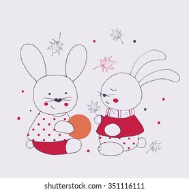  Hand drawn vector illustration/t-shirt print featuring two cute rabbits  playing with ball .can be used for kids' or babies' shirt designs
