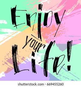 Hand drawn vector lettering. Enjoy your life phrase by hand on bright background. Vector illustration. Handwritten modern calligraphy. Inscription for postcards, posters, prints, greeting cards.