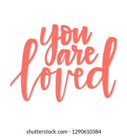 Hand drawn vector lettering You are loved in coral color on a white background. Vector illustration, perfect for St. Valentine's day.