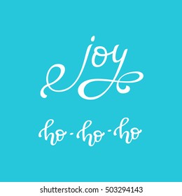 Hand drawn vector quotes. Joy. Ho ho ho. Isolated white ink calligraphy on bright blue background. Quote about winter and Christmas.