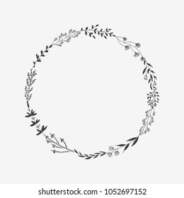 Hand drawn vector round frame with floral elements, herbs, leaves, flowers, twigs, branches