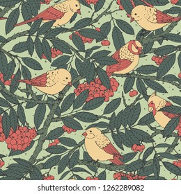 Hand drawn vector seamless pattern with birds, branches, leaves and rowanberry on green dotted background. Spring decoration ornament for fabric, textile, covers or wrapping paper.
