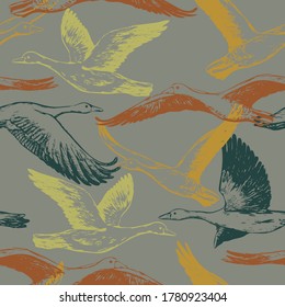 Hand drawn vector seamless pattern of flying greylag geese. Background of wild birds realistic ink sketches. Abstract colorful design for wallpaper, wrapping, textile, postcard, print, fabric, decor.