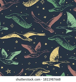 Hand drawn vector seamless pattern of flying greylag geese. Background of wild birds realistic ink sketches. Abstract colorful design for wallpaper, wrapping, textile, postcard, print, fabric, decor.