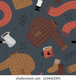 Hand drawn vector seamless pattern with cozy sweaters and coffee mugs in flat style