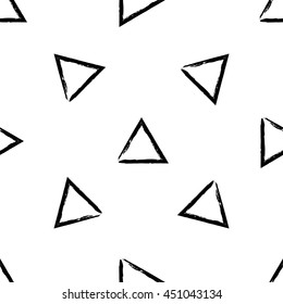 Hand Drawn vector seamless pattern made with ink. Triangles shapes isolated. Fabric texture