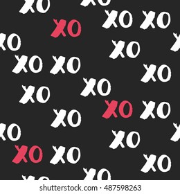 Hand drawn vector seamless pattern with XOXO. Hipster symbols of hugs and kisses. Good for cards, wallpaper, posters, wrapping paper, invitations. Trendy graphic design. Fashionable textile print. 