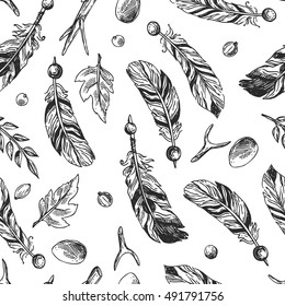 Hand drawn vector seamless pattern with feathers. Boho style drawing.