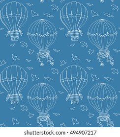 Hand drawn vector seamless pattern. Air balloons and birds on blue backgroung