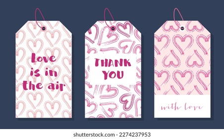 Hand drawn vector set of gift tags with hearts. Love and romantic tags isolated on dark background. Romantic labels for decorative design. Template for holidays and wedding designs.
