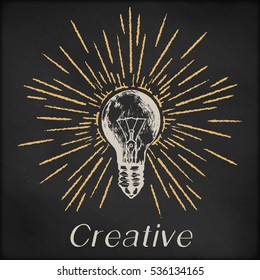 Hand Drawn Vector Sketch Illustration - Creative Vintage Tee Shirt Apparel Print Poster Design, Realistic Light Bulb With Sunburst, Black Chalkboard Background.