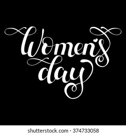Hand drawn vector white  lettering "Women's day" on black background.