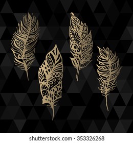 Hand drawn vector zentangle gold feathers set on black triangle geometric background. Ethnic ink openwork tribal feathers, stylized for invitation cards in vintage boho style.