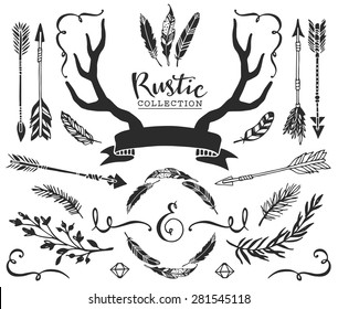 Hand drawn vintage antlers, feathers, arrows with lettering. Rustic decorative vector design set.