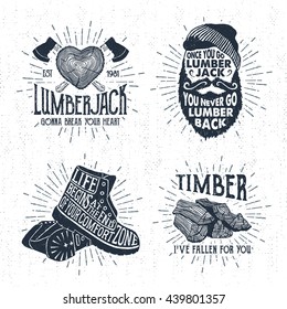 Hand drawn vintage badges set with textured tree trunk, crossed axes, bearded face, boots, and timber vector illustrations and inspirational lettering.