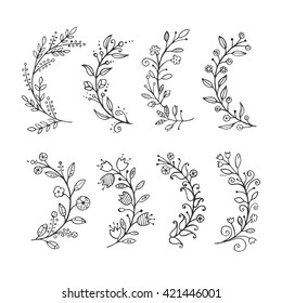 Hand Drawn vintage floral elements. Doodle black floral twigs on white background