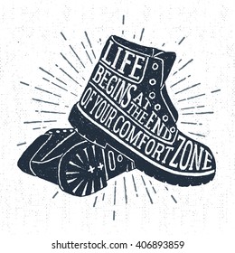 Hand drawn vintage label with textured boots vector illustration and "Life begins at the end of your comfort zone" inspirational lettering.