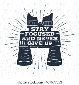 Hand drawn vintage label with textured binoculars vector illustration and "Stay focused and never give up" inspirational lettering.