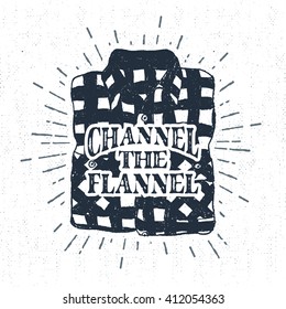 Hand drawn vintage label with textured plaid shirt vector illustration and "Channel the flannel" lettering.