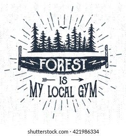 Hand drawn vintage label with textured saw vector illustration and "Forest is my local gym" lettering.