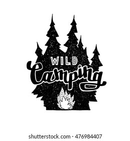 Hand drawn vintage label with, forest and bonfire. Hand made badge. Lettering with text: Wild Camping. Hand crafted vector illustration for design, print, poster, greeting card.