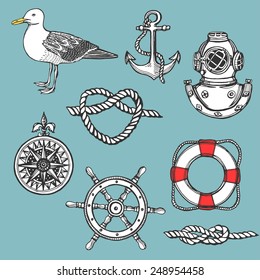 Hand drawn vintage nautical set.  Anchor, lifebuoy, knot, diving helmet, wind rose, seagull, steering wheel. 