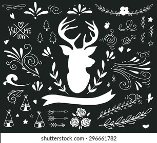 Hand drawn vintage set with a reindeer and different design elements on blackboard (banner, branches, flowers, lettering, curls)