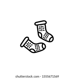 Hand drawn warm knitted socks with snowflake pattern. Doodle logo vector outline design illustration isolated on white background.