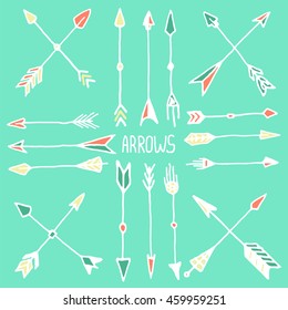 Hand drawn white arrow set. Vector illustration of hipster design element on green background