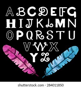 Hand drawn white brush whiting alphabet, font, letters, watercolor feathers on chalkboard, blackboard background 
