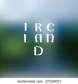 Hand drawn white ink vector lettering "Ireland" on blue blurred background. 