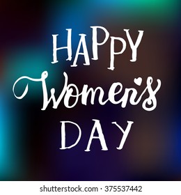 Hand drawn white ink vector lettering "Women's day" on green blurred background. 