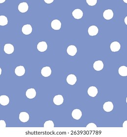 hand drawn white polka dot pattern on blue background. Seamless vector design element.