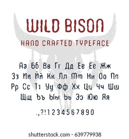 Hand drawn Wild bison font. Cyrillic alphabet vector letters, numbers, and signs. Buffalo skull with feathers vector illustration.