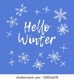 Hand drawn winter card. Blue and white background. Abstract  doodle drawing snowflake. Vector art illustration snow and text