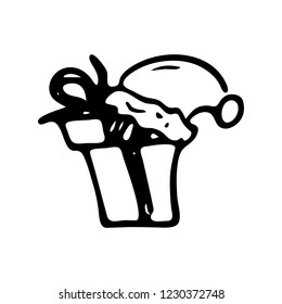 Hand drawn winter hat on the gift doodle. Sketch winter icon. Decoration element. Isolated on white background. Vector illustration.