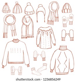 Hand drawn winter knitted clothes set .  Vector sketch  illustration.