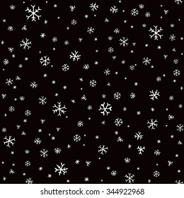 Hand drawn winter pattern with snowflakes. Seamless doodle background.