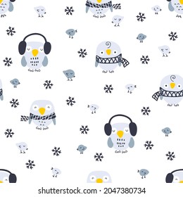 Hand drawn winter seamless pattern with owls, birds and snowflakes. Perfect for T-shirt, textile and prints. Cartoon style vector illustration for decor and design.


