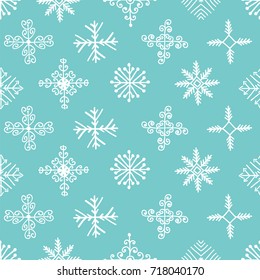 Hand drawn winter seamless patterns. Christmas, New Year backdrop. Decorative background with snowflakes for fabric, textile, wrapping paper, card, invitation, wallpaper, web design
