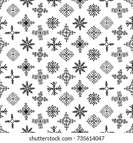 Hand drawn winter seamless patterns. Christmas, New Year backdrop. Decorative background with snowflakes for fabric, textile, wrapping paper, card, invitation, wallpaper, web design
