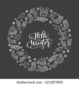 Hand drawn winter symbol in a circle with handwritten phrase Hello Winter inside. Print for T-shirt, poster, greeting cards. Vector illustration on dark background