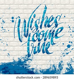 Hand drawn wishes come true on a brick wall.