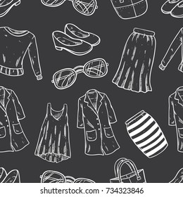 hand drawn woman fashion clothing and accessories in seamless pattern with black background