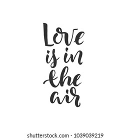 Hand drawn word. Brush pen lettering with phrase " love is in the air "