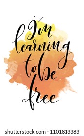 Hand drawn word. Brush pen lettering with phrase I’m learning to be free.