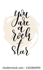 Hand drawn word. Brush pen lettering with phrase You are a rock star.